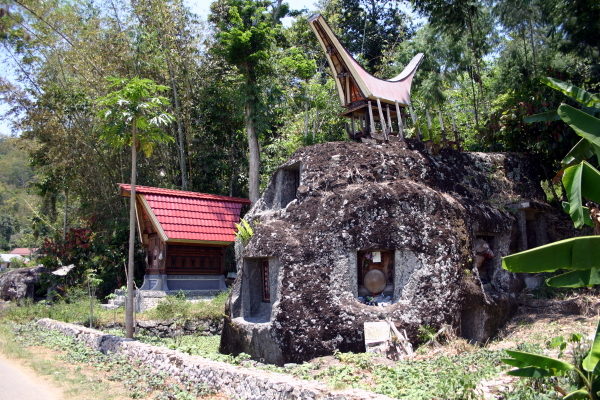 A single large boulder with several tombs carved into it